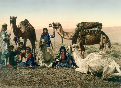Western travellers dressed as Bedouins and their guides with their camels in the Jordan Valley by Swiss Photographer